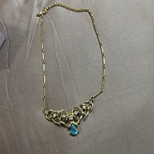 Elegant Gold Necklace with Blue Gemstone